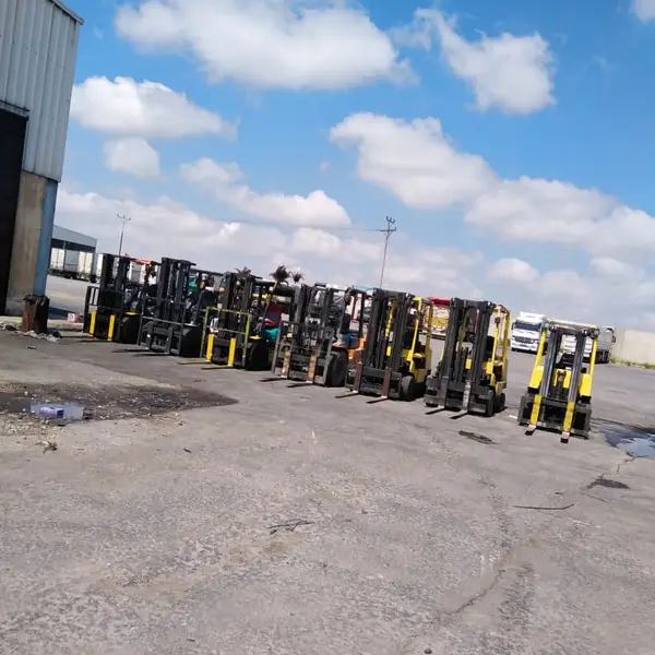 Row of forklifts in multiple capacities ready for dispatch